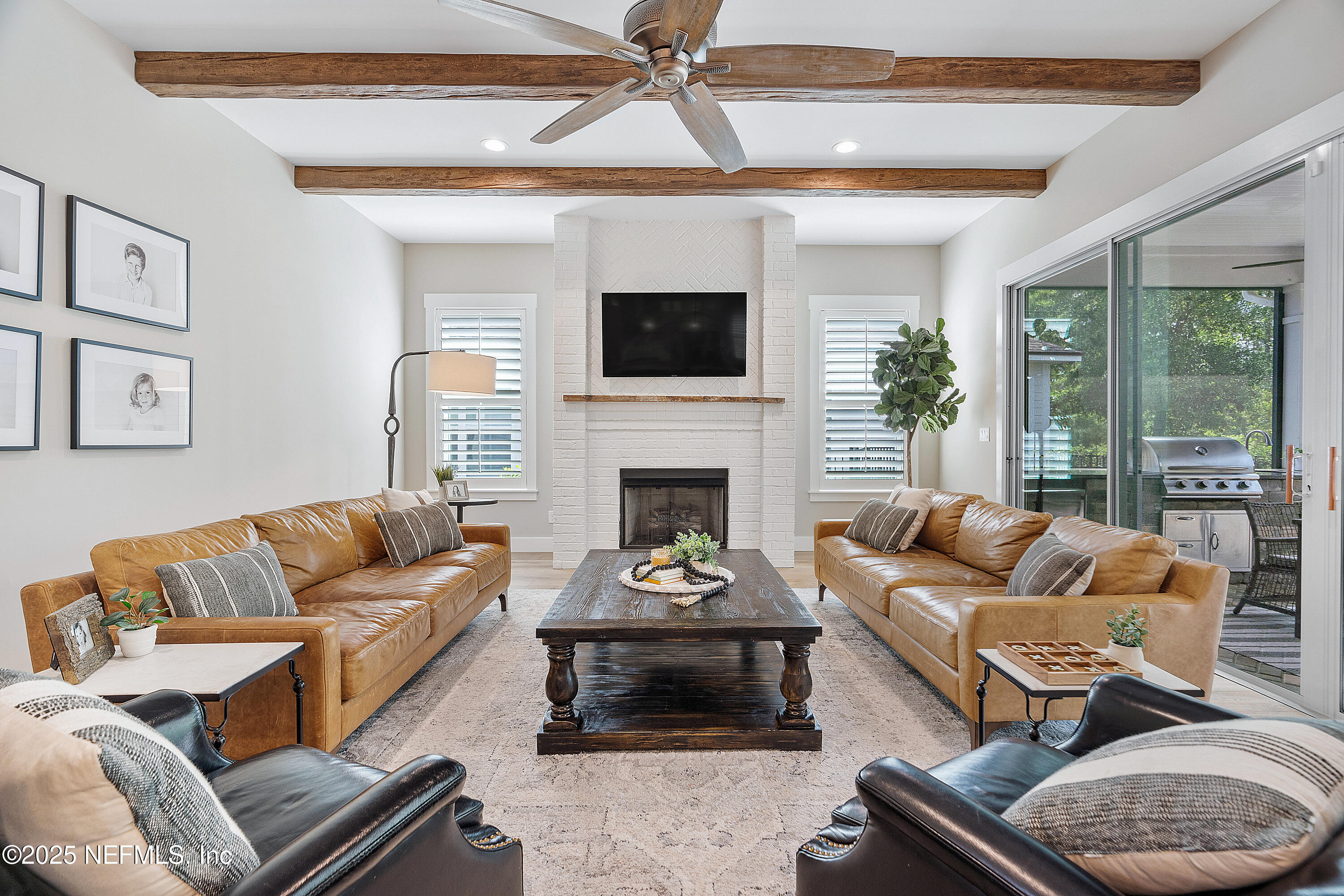 295 Seahill Drive St. Augustine, FL 32092 - Photo 19 of 101 a living room with furniture and a fireplace