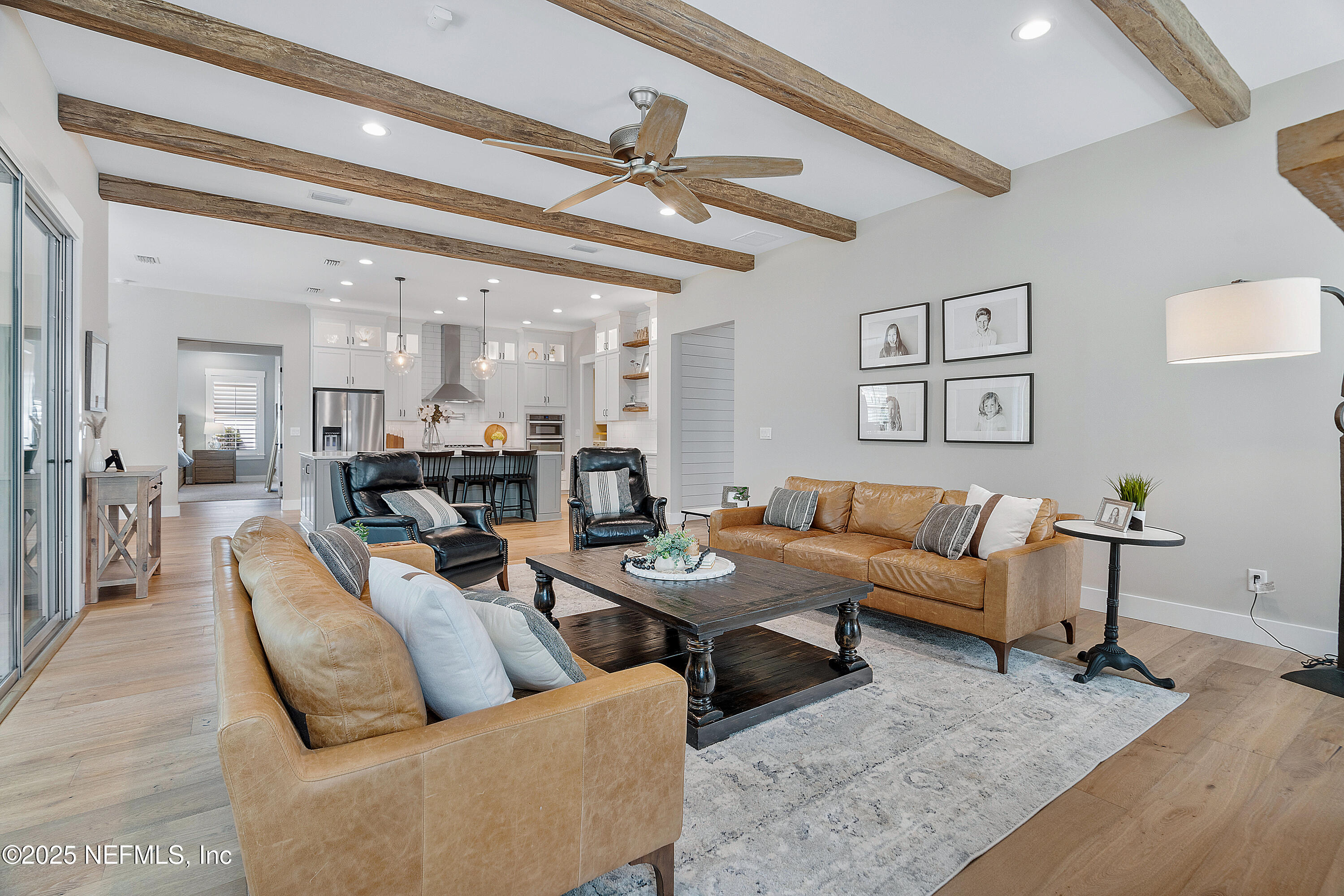 295 Seahill Drive St. Augustine, FL 32092 - Photo 21 of 101 a living room with furniture and a view of kitchen