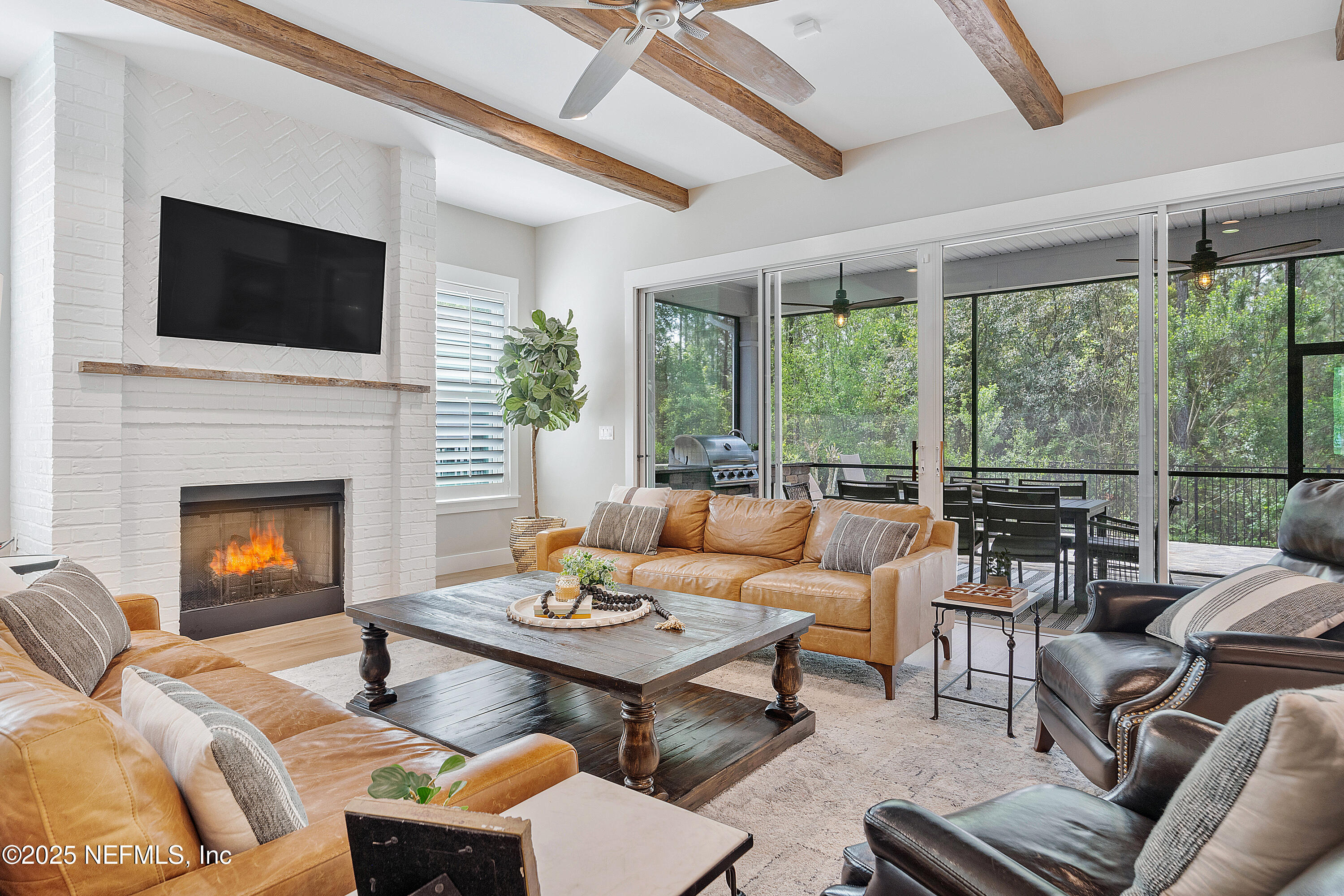 295 Seahill Drive St. Augustine, FL 32092 - Photo 22 of 101 a living room with furniture fireplace and a flat screen tv