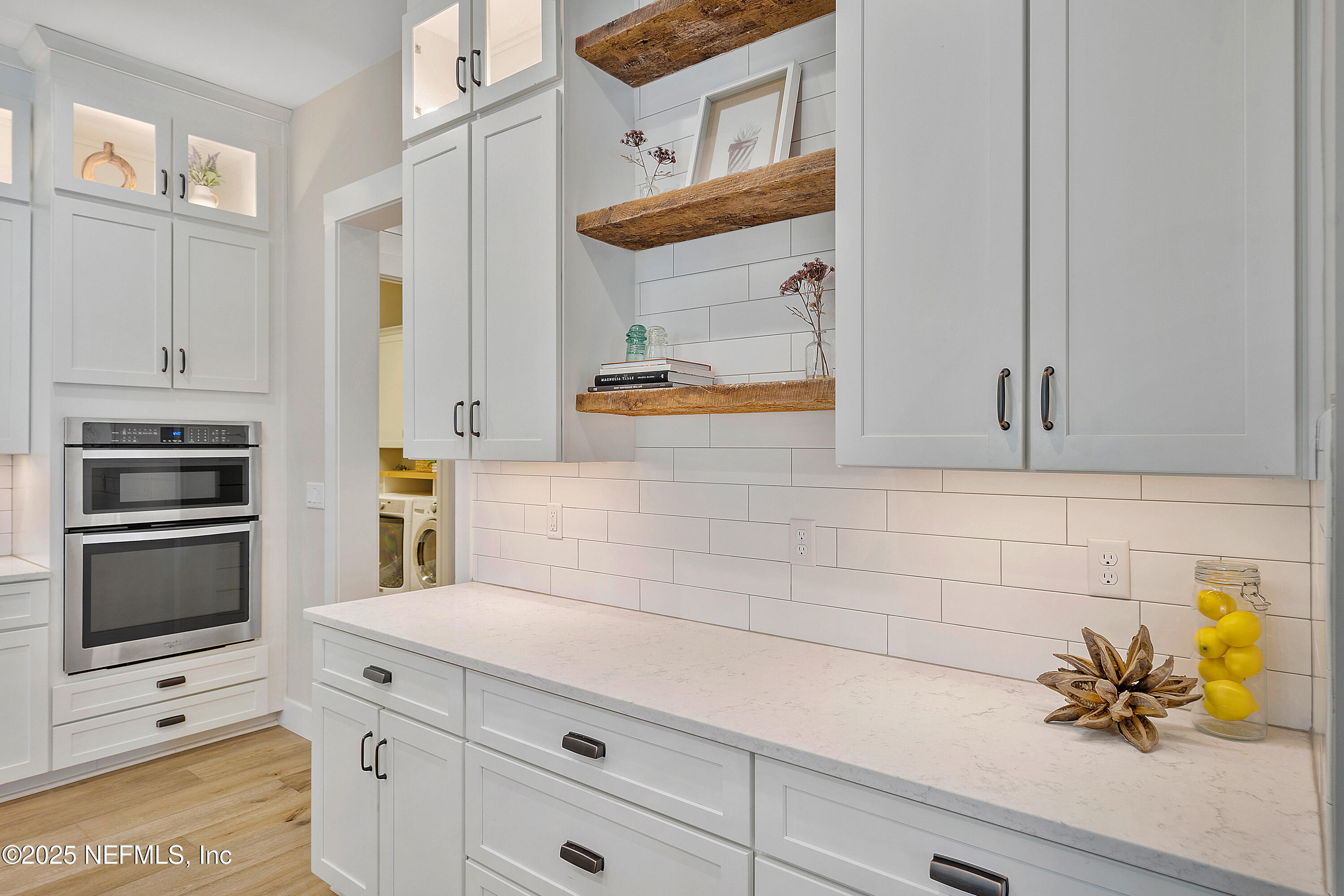 295 Seahill Drive St. Augustine, FL 32092 - Photo 27 of 101 a kitchen with stainless steel appliances white cabinets and a stove
