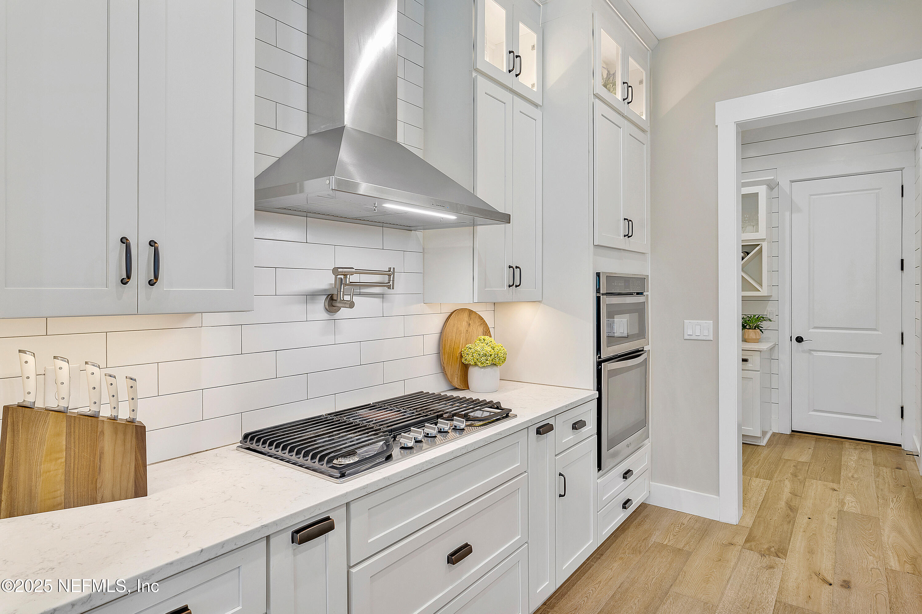 295 Seahill Drive St. Augustine, FL 32092 - Photo 30 of 101 a kitchen with a stove and cabinets