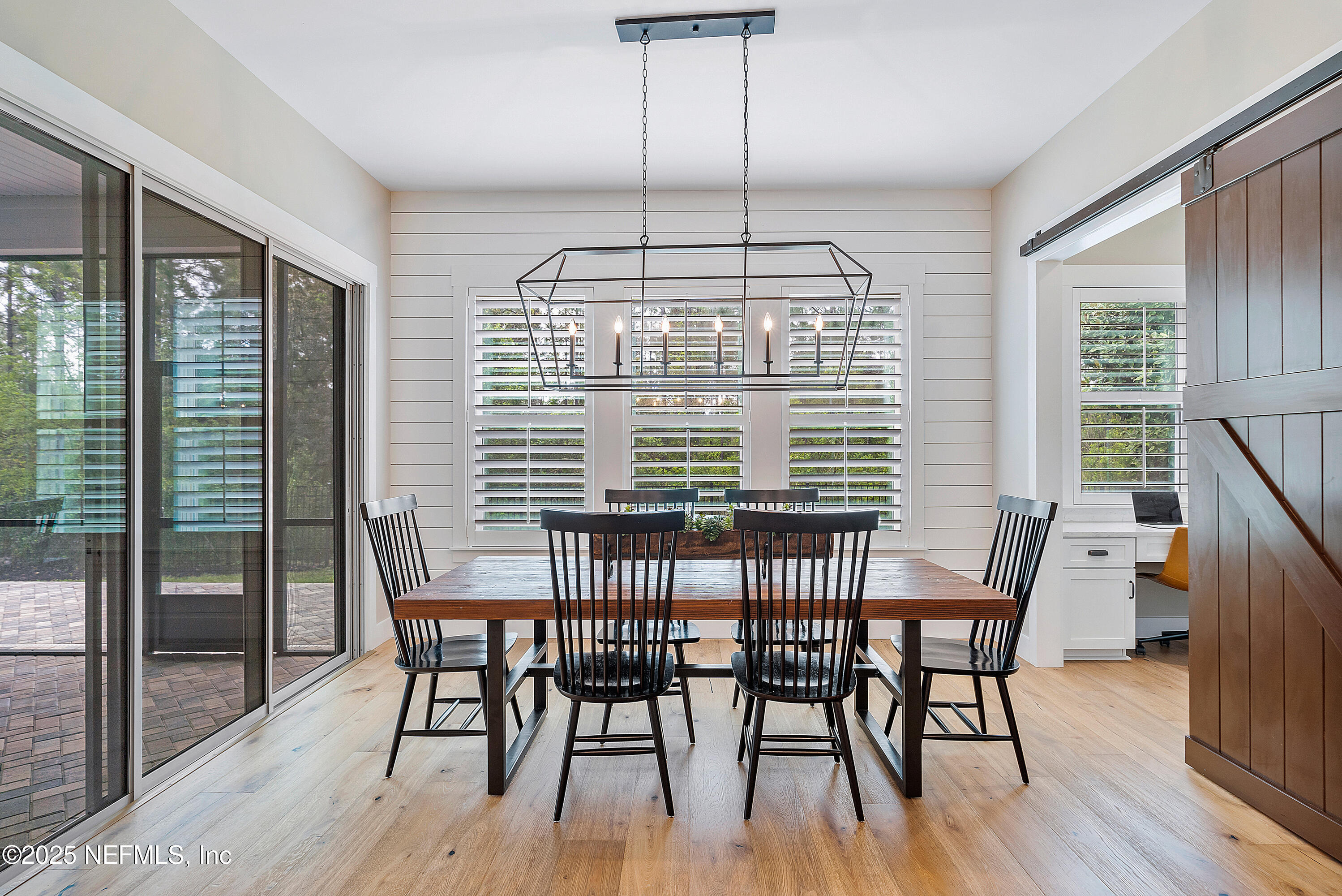 295 Seahill Drive St. Augustine, FL 32092 - Photo 35 of 101 a view of a dining room with furniture window and wooden floor
