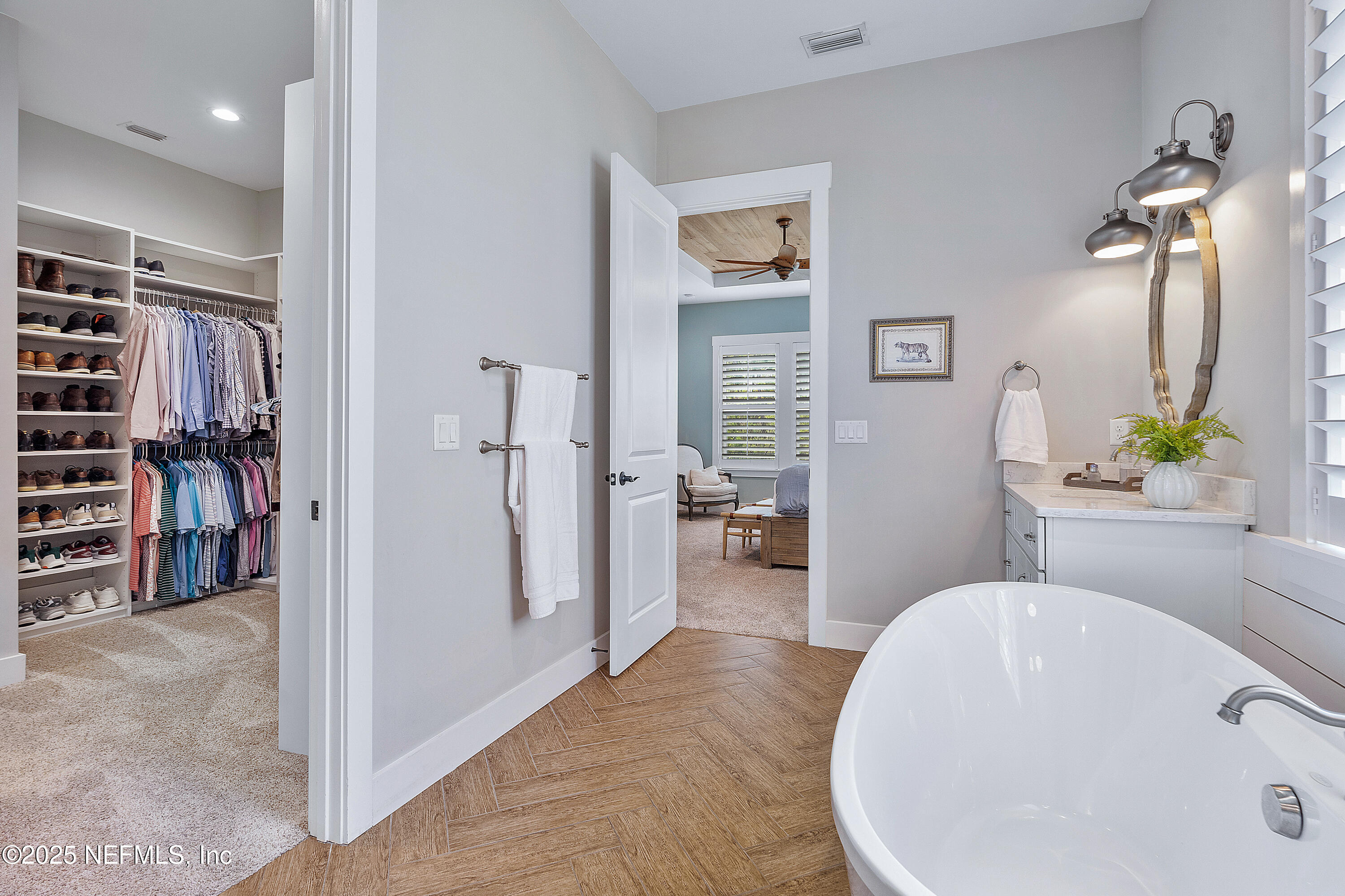 295 Seahill Drive St. Augustine, FL 32092 - Photo 50 of 101 a en suite bathroom with a tub shower and a sink