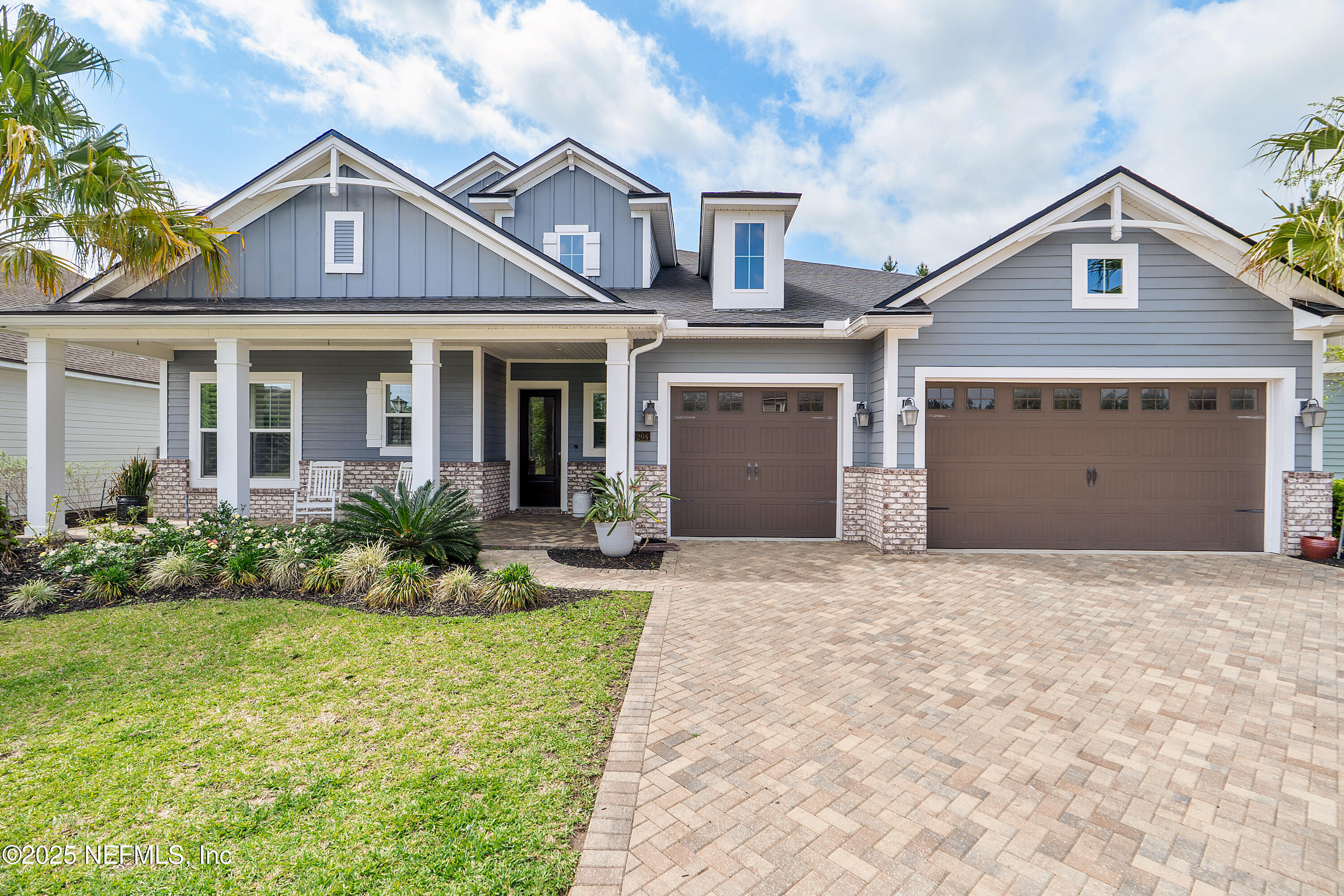 295 Seahill Drive St. Augustine, FL 32092 - Photo 5 of 101 a front view of a house with a yard and garage