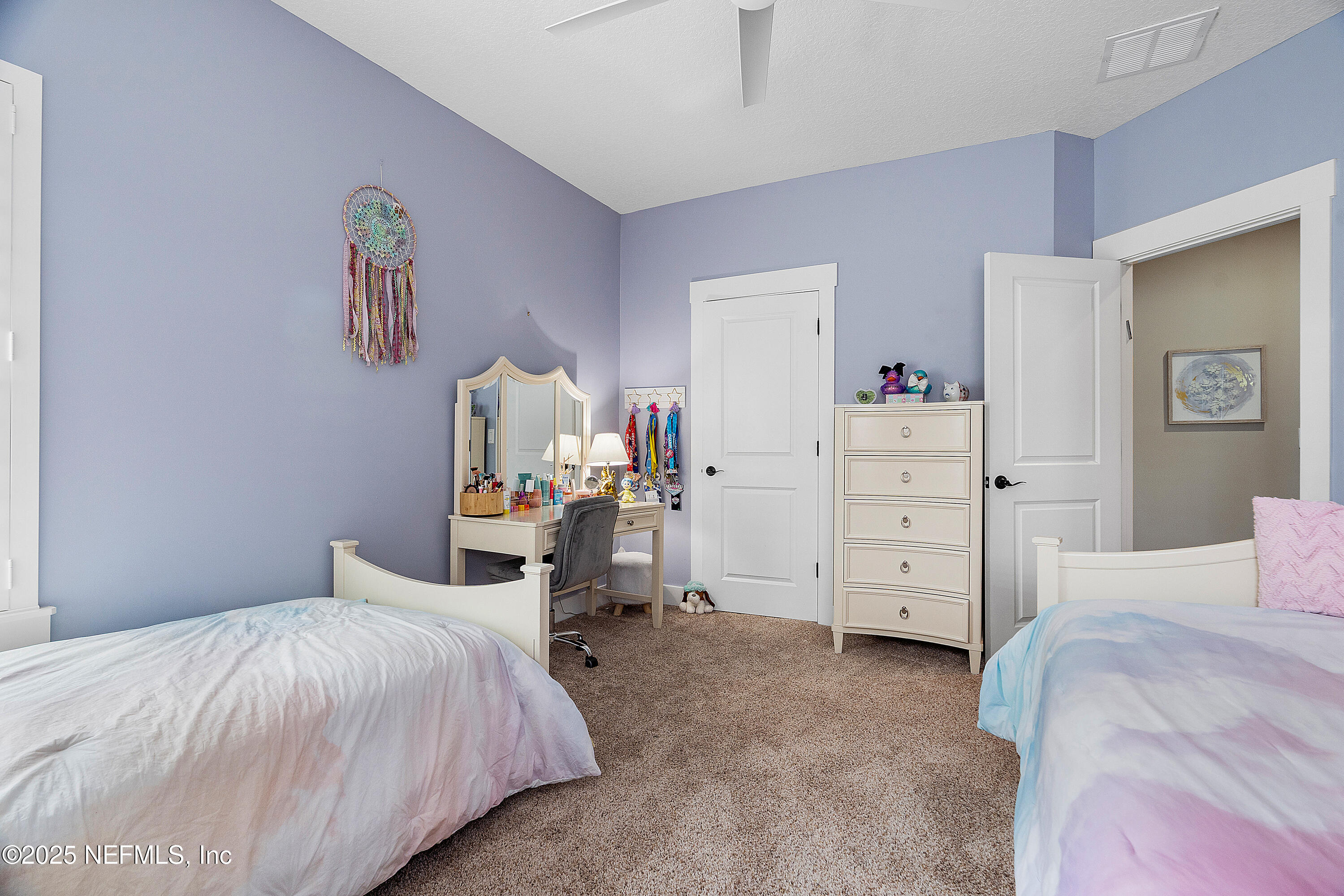 295 Seahill Drive St. Augustine, FL 32092 - Photo 60 of 101 a bedroom with a bed and a cabinet