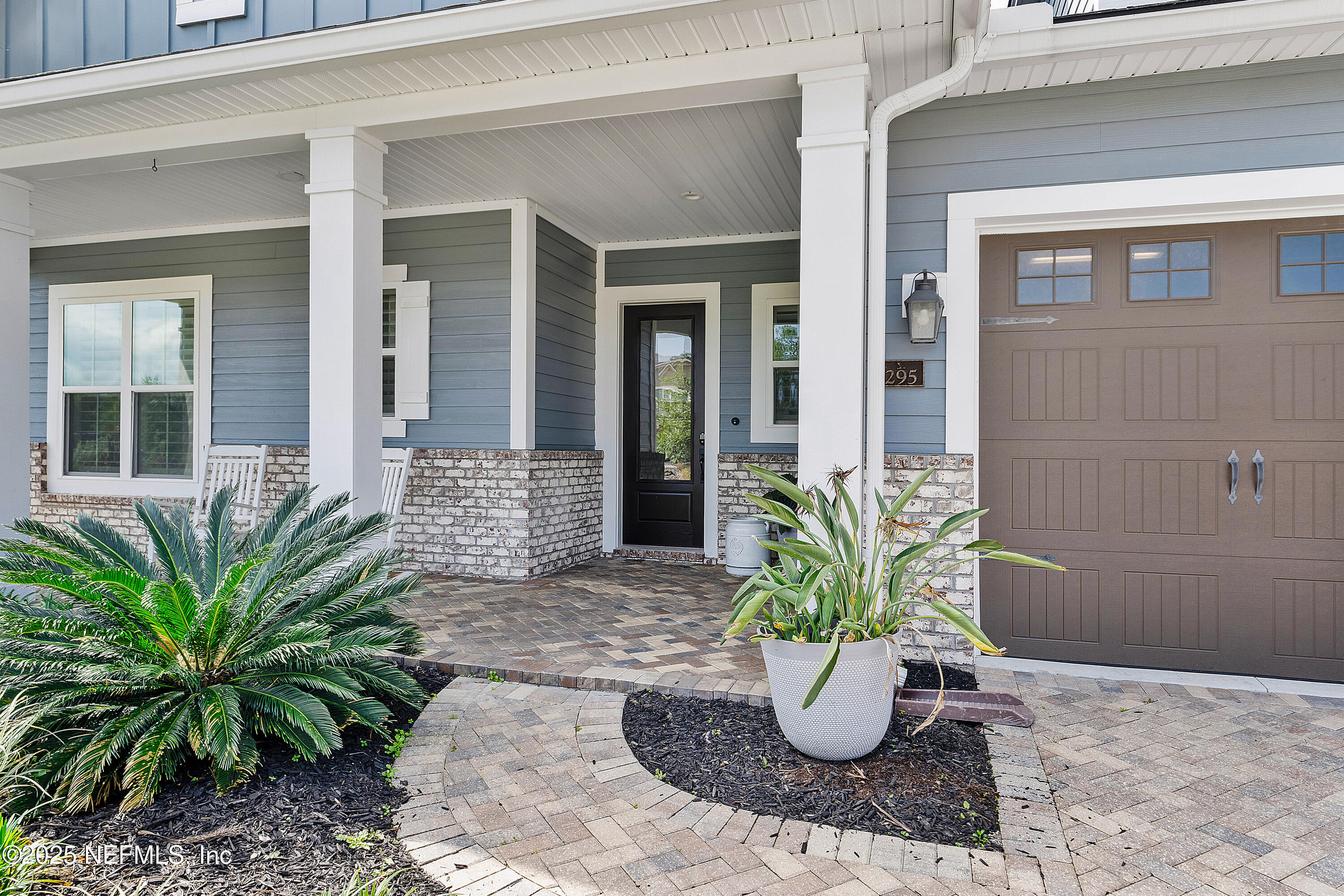 295 Seahill Drive St. Augustine, FL 32092 - Photo 6 of 101 a view of potted plant in front of a glass door