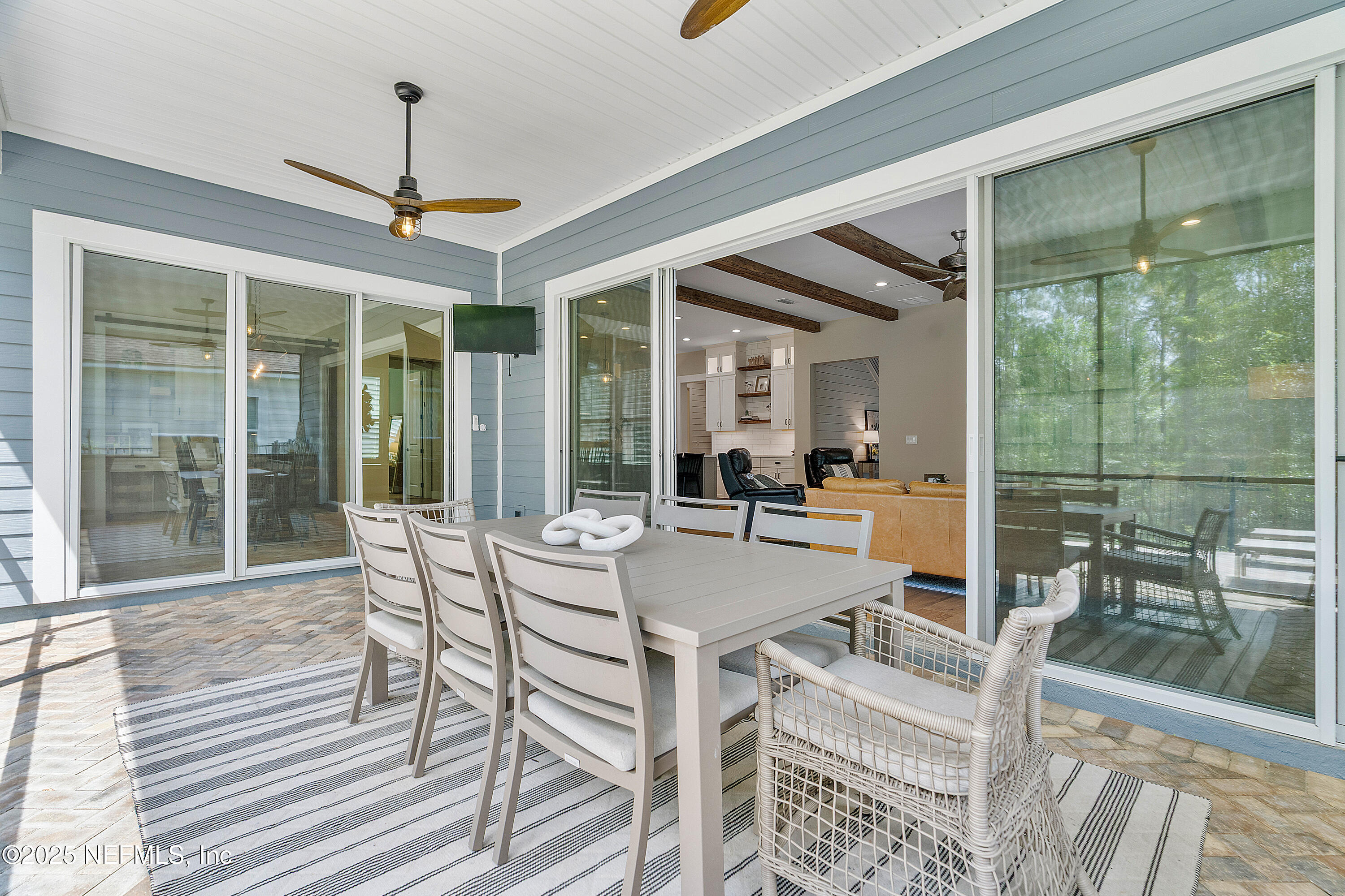 295 Seahill Drive St. Augustine, FL 32092 - Photo 66 of 101 a view of a dining room with furniture wooden floor and a chandelier