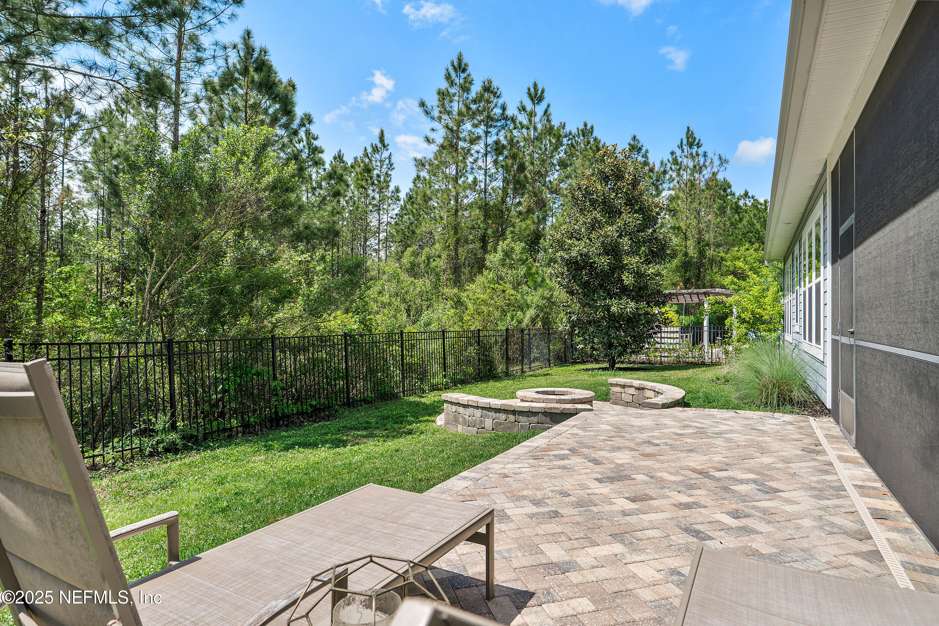 295 Seahill Drive St. Augustine, FL 32092 - Photo 72 of 101 a view of backyard with a garden and trees