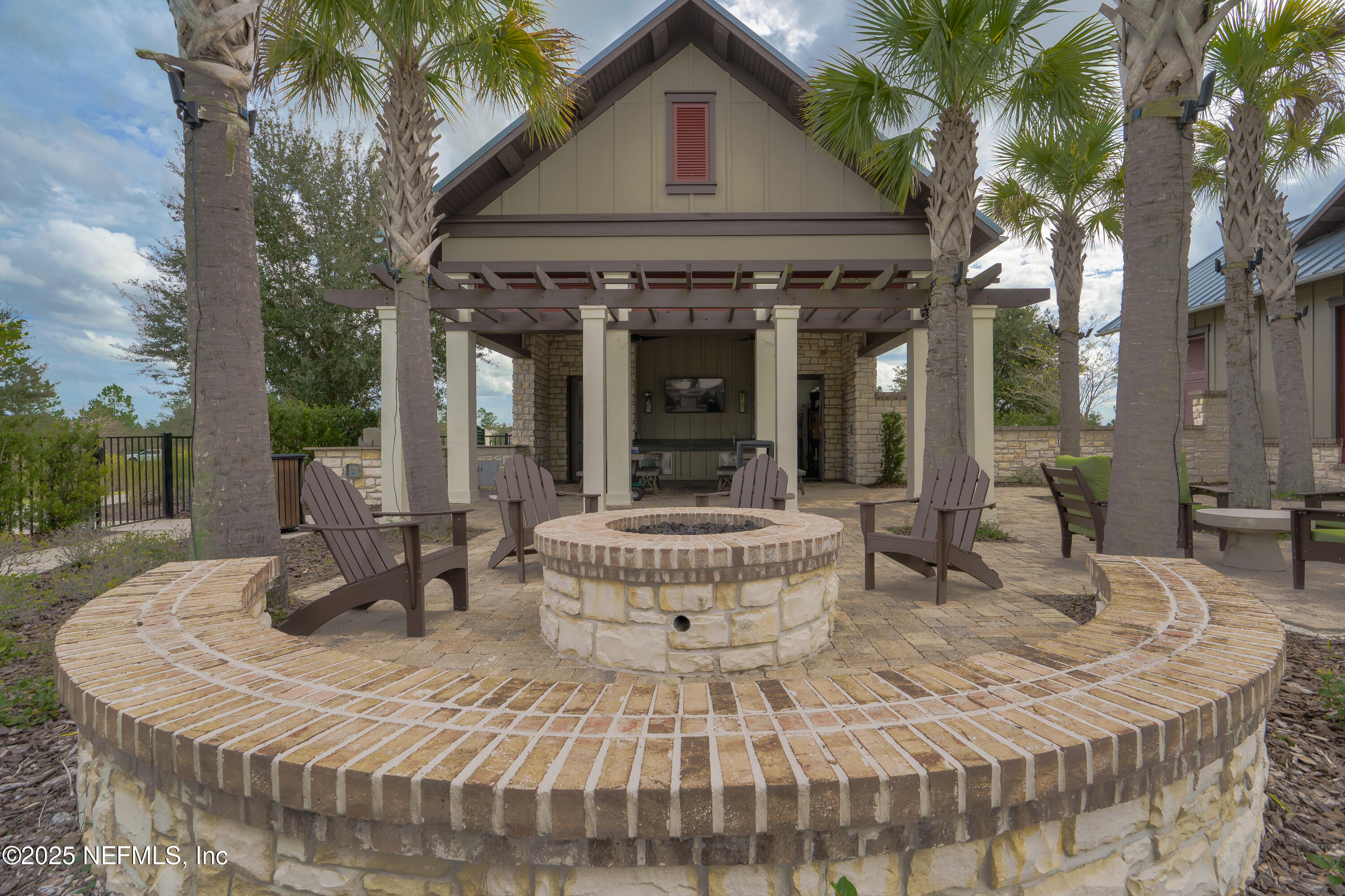 295 Seahill Drive St. Augustine, FL 32092 - Photo 92 of 101 a view of a patio with table and chairs and potted plants