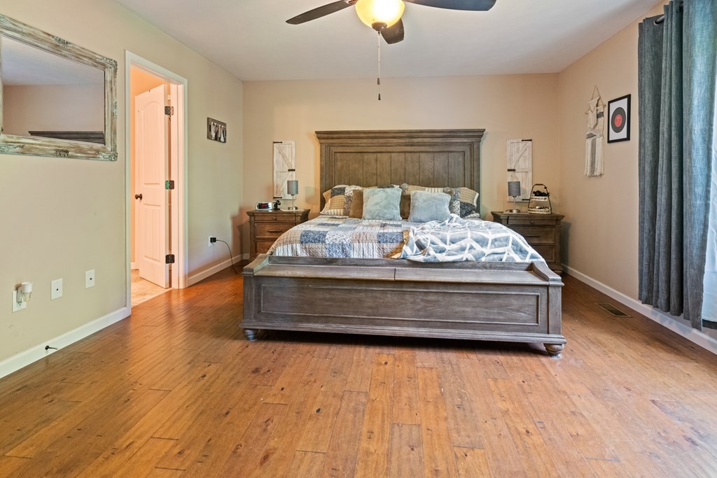 5006 Jimmie Neal Road Baxter, TN 38544 - Photo 12 of 22 a bedroom with a bed and a chandelier