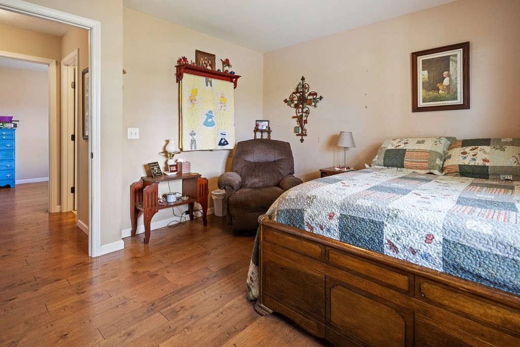 5006 Jimmie Neal Road Baxter, TN 38544 - Photo 15 of 22 a bedroom with bed and wooden floor