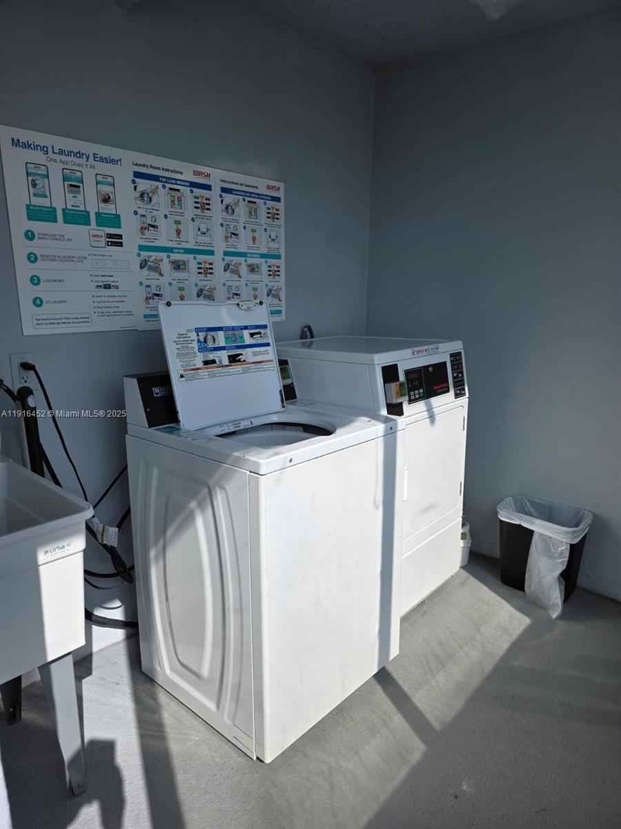 7440 Harding Avenue, Unit 204 Miami Beach, FL 33141 - Photo 13 of 37 a utility room with dryer and washer