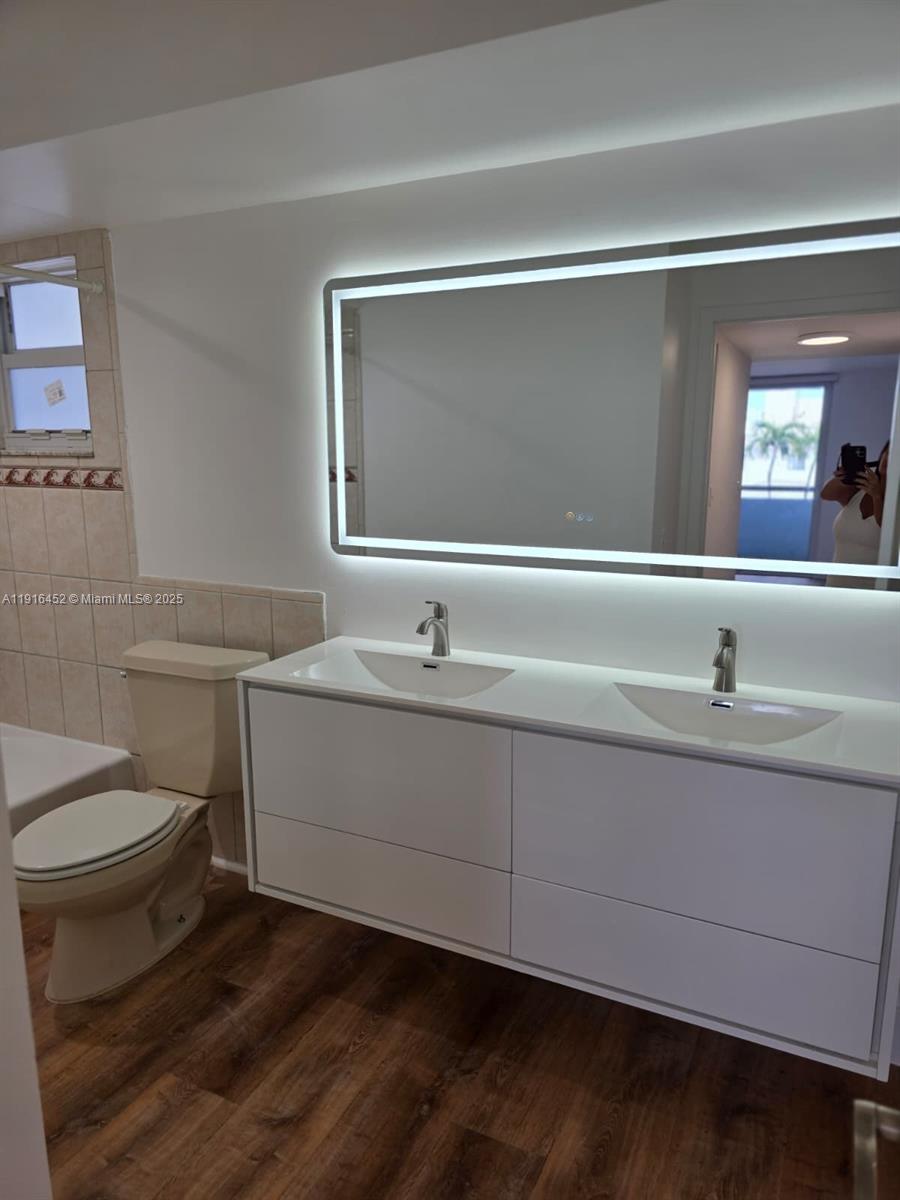 7440 Harding Avenue, Unit 204 Miami Beach, FL 33141 - Photo 23 of 37 a bathroom with a sink and a toilet