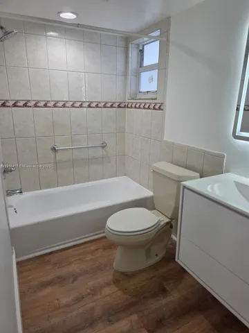a bathroom with a toilet sink and a shower