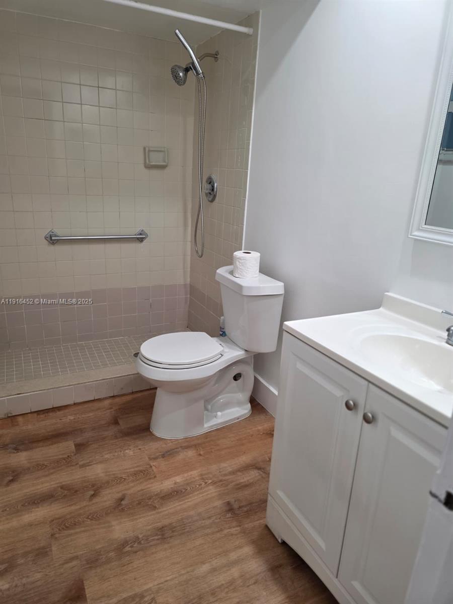 7440 Harding Avenue, Unit 204 Miami Beach, FL 33141 - Photo 26 of 37 a bathroom with a toilet sink and a shower