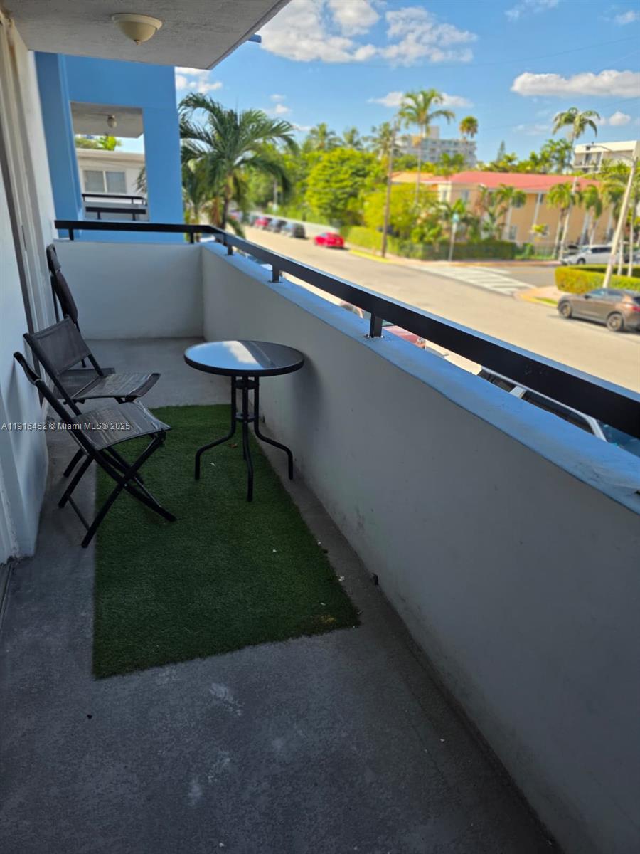 7440 Harding Avenue, Unit 204 Miami Beach, FL 33141 - Photo 29 of 37 a view of swimming pool from a balcony