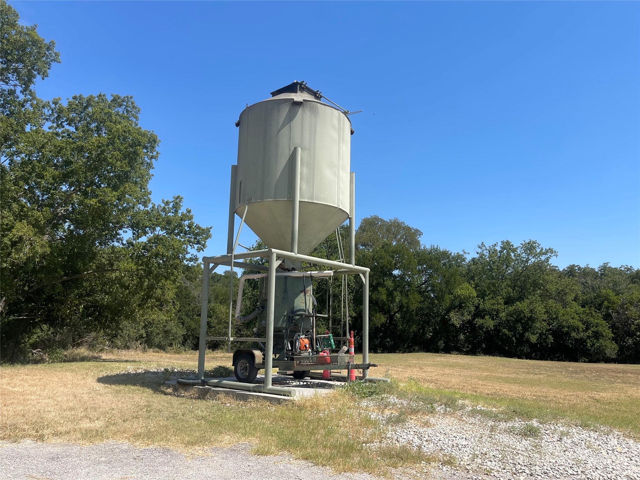 Lot 35 Cattle Trail Kempner, TX 76539 - Photo 14 of 20 A tall feed silo stands on a concrete pad surrounded by open pasture.