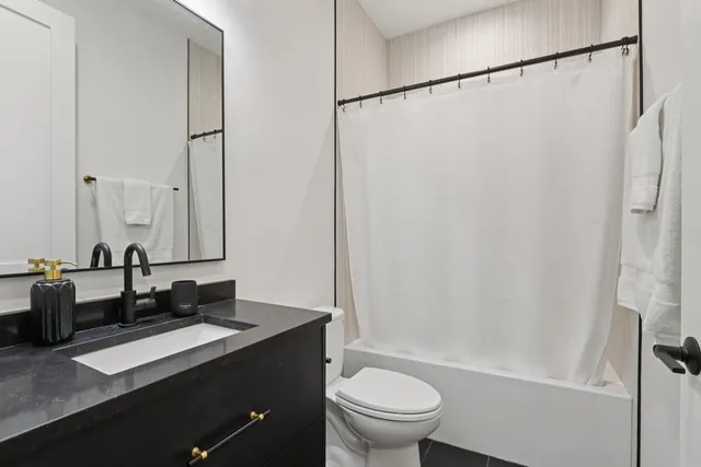 a bedroom with a bed and hallway