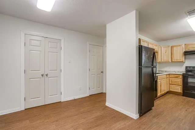a kitchen with a refrigerator freezer and a stove