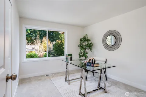 a work room with furniture and a window