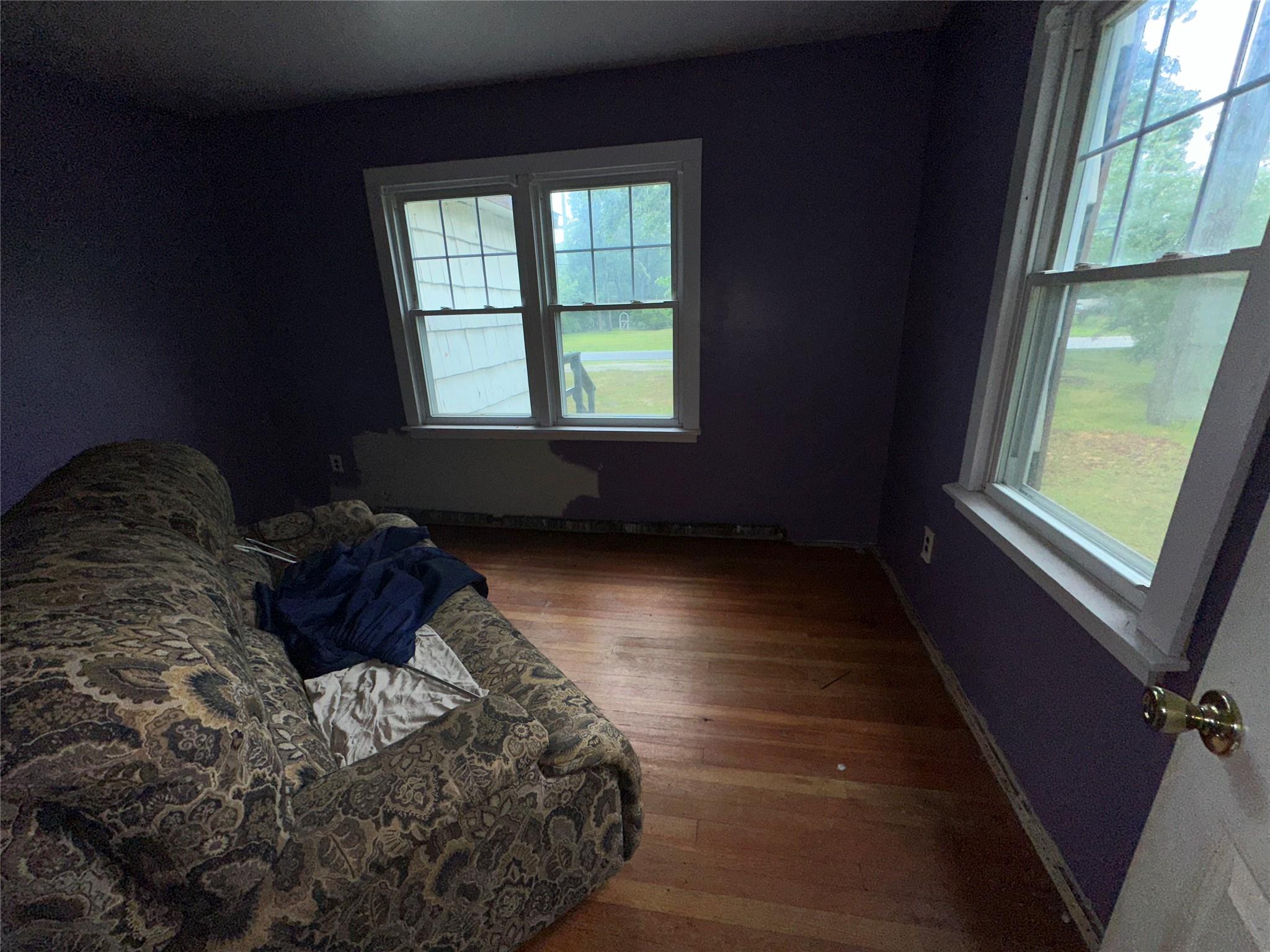 77 Lincoln Road Medford, NY 11763 - Photo 8 of 14 a bed sitting in a bedroom next to a window