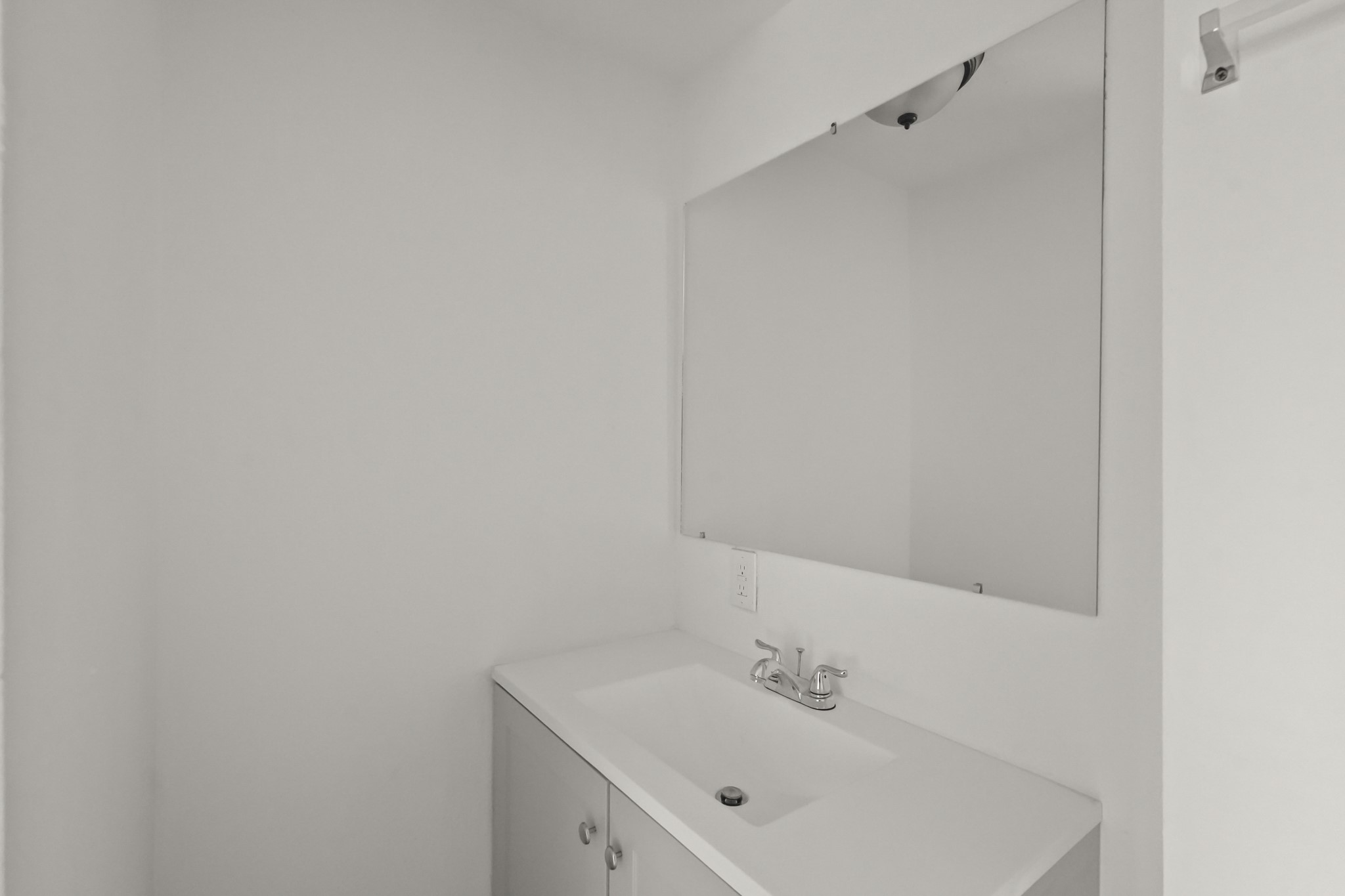 105 West Linney Street Dayton, TX 77535 - Photo 31 of 48 a bathroom with a sink and mirror