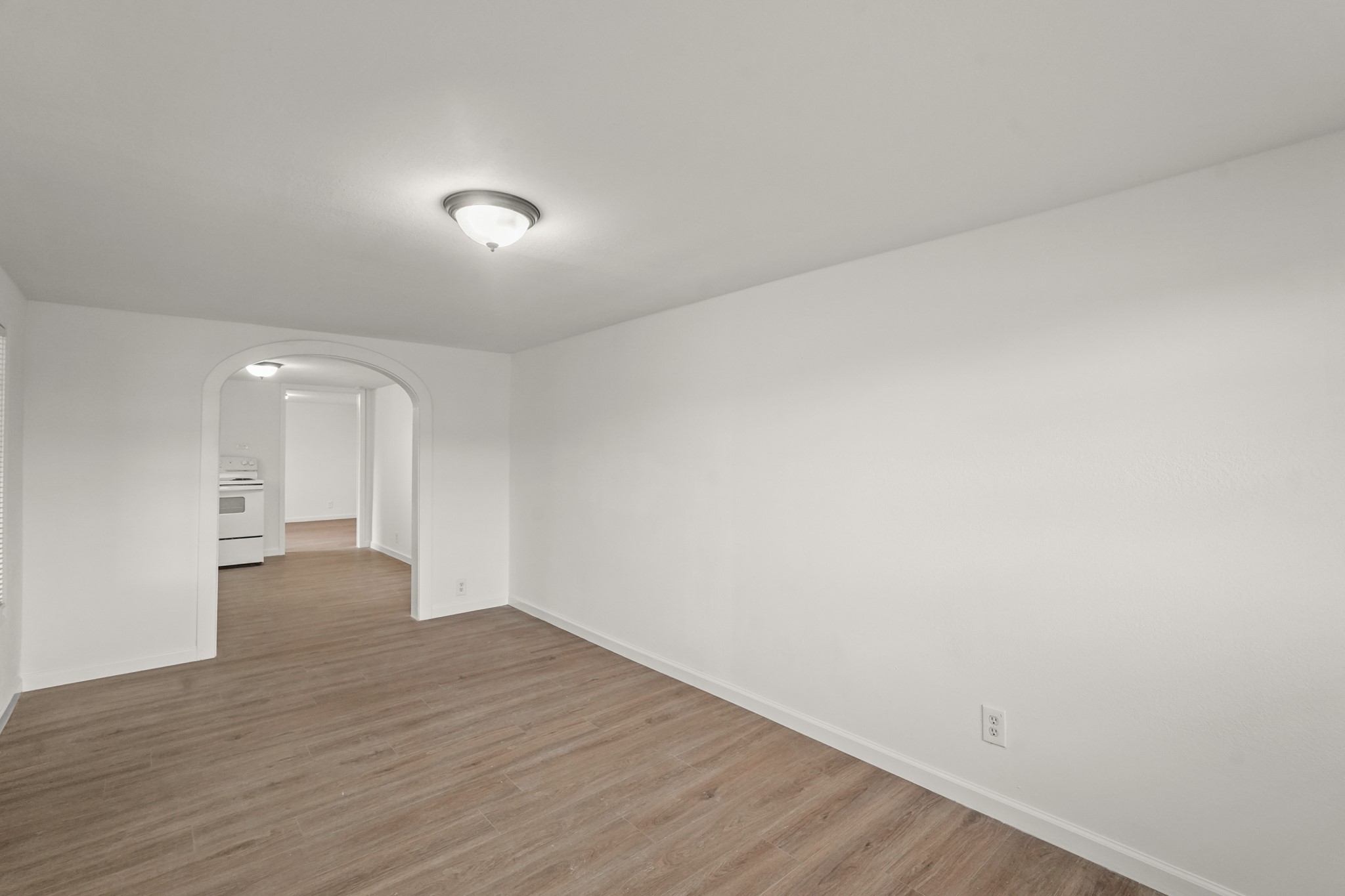 105 West Linney Street Dayton, TX 77535 - Photo 35 of 48 a view of an empty room with wooden floor