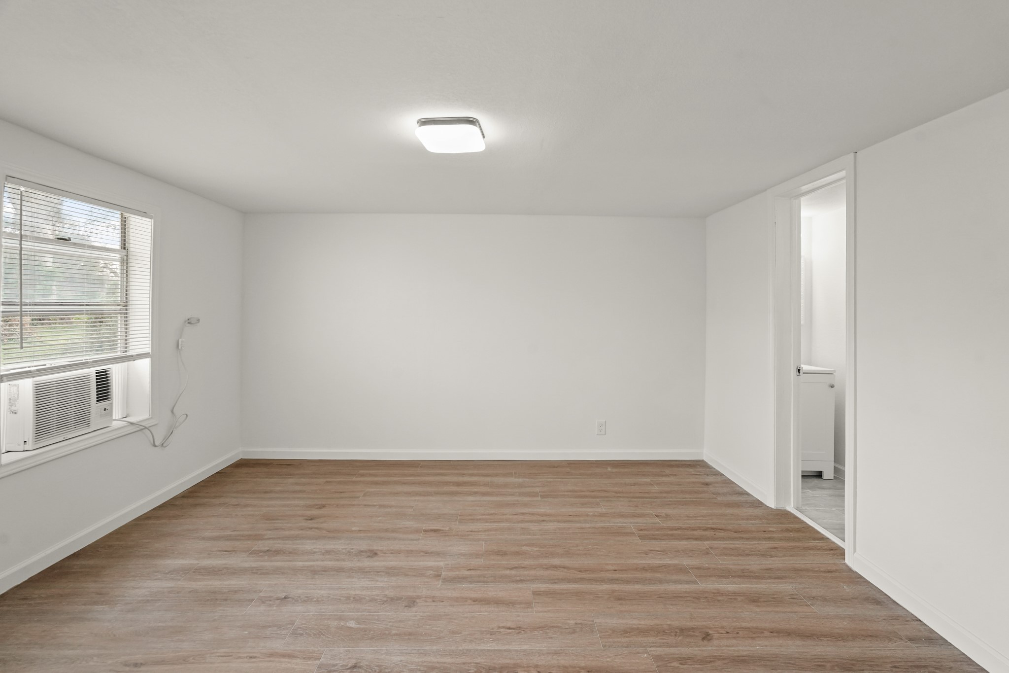 105 West Linney Street Dayton, TX 77535 - Photo 39 of 48 wooden floor in an empty room