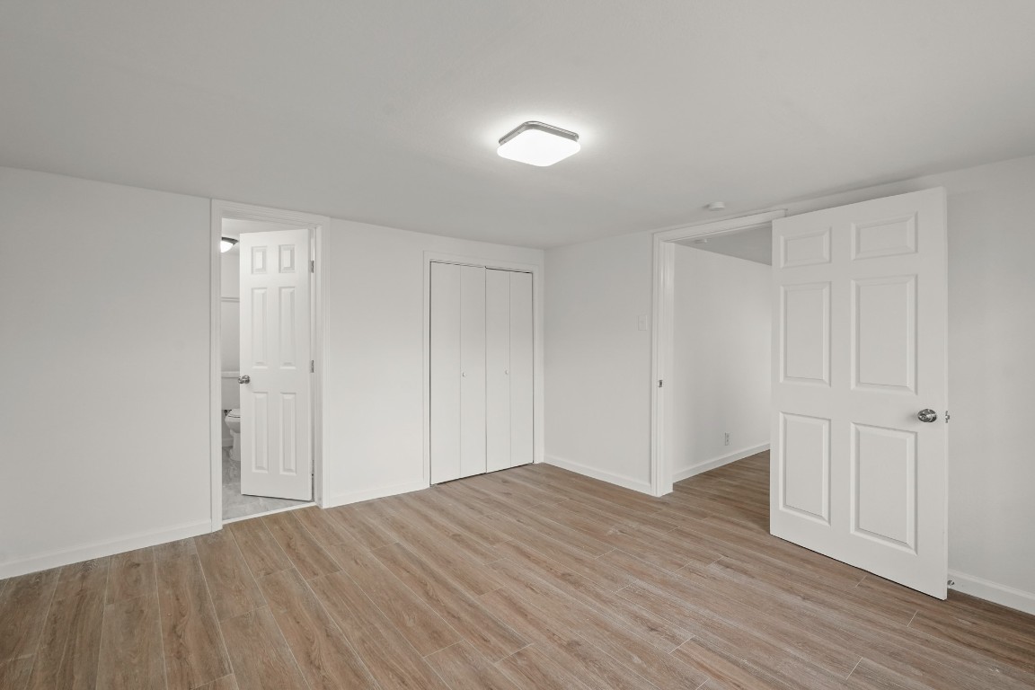 105 West Linney Street Dayton, TX 77535 - Photo 41 of 48 a view of empty room with wooden floor