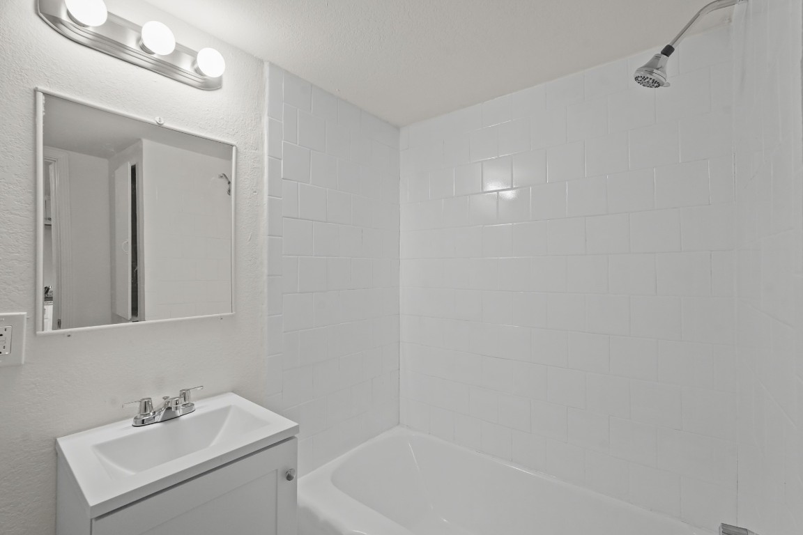 105 West Linney Street Dayton, TX 77535 - Photo 48 of 48 a bathroom with a sink mirror and vanity