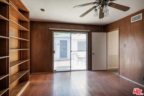 a view of room with wooden floor and closet