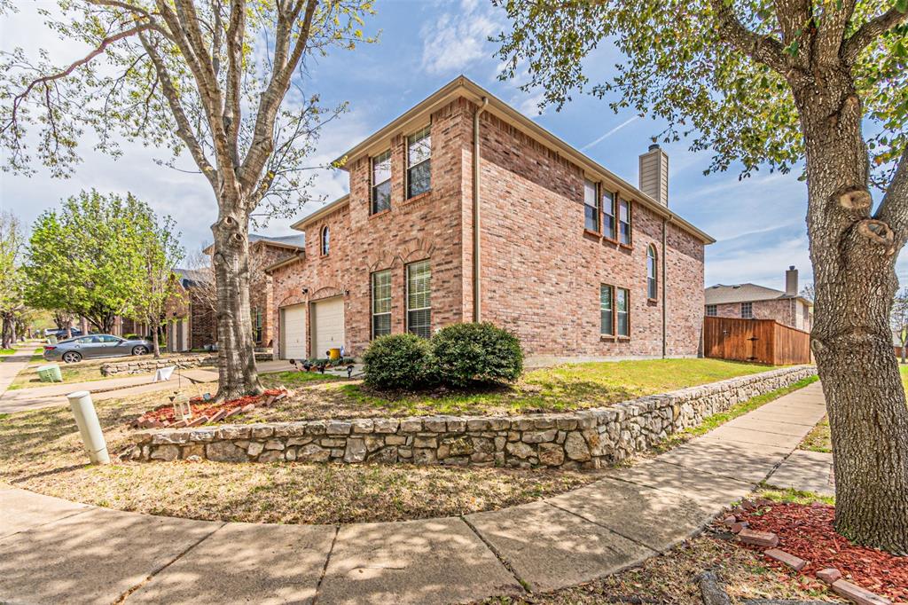 2428 Becard Drive Mesquite, TX 75181 - Photo 1 of 26 View of home's exterior with a chimney, fence, brick siding, and driveway