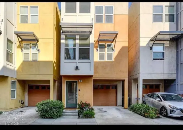 a front view of a building with a garden