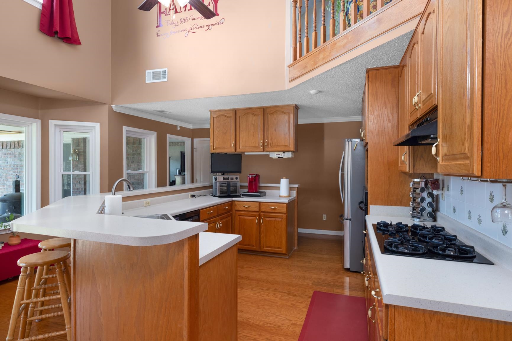 8539 Campground Road Drummonds, TN 38023 - Photo 10 of 38 a kitchen with sink a refrigerator and a stove