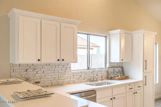 a bathroom with a sink and a window