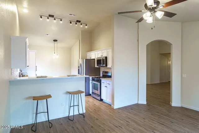 a bathroom with a sink vanity and a mirror