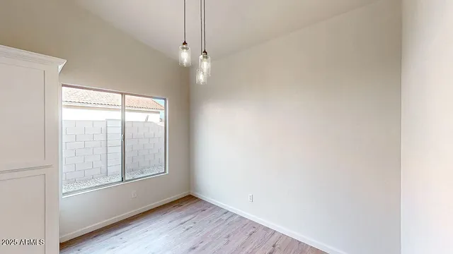 a bathroom with a bathtub and a window