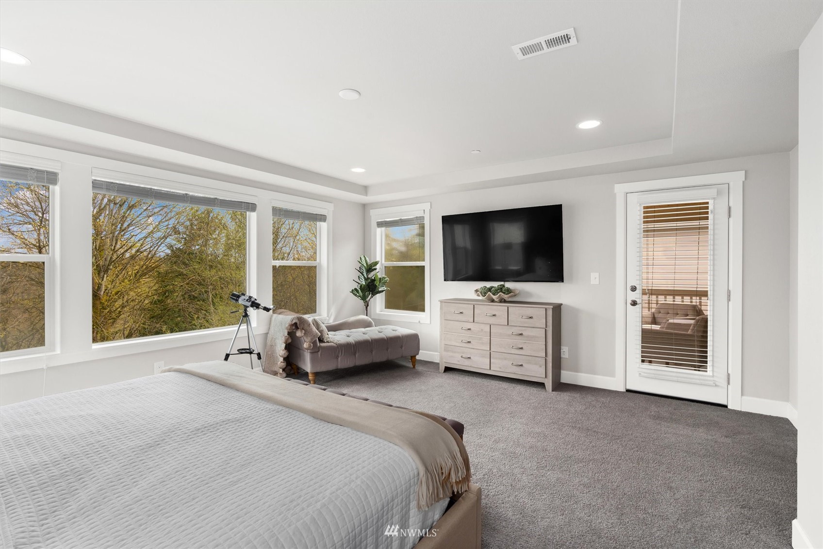 18307 3rd Drive Southeast Bothell, WA 98012 - Photo 18 of 40 a spacious bedroom with a bed and a flat screen tv
