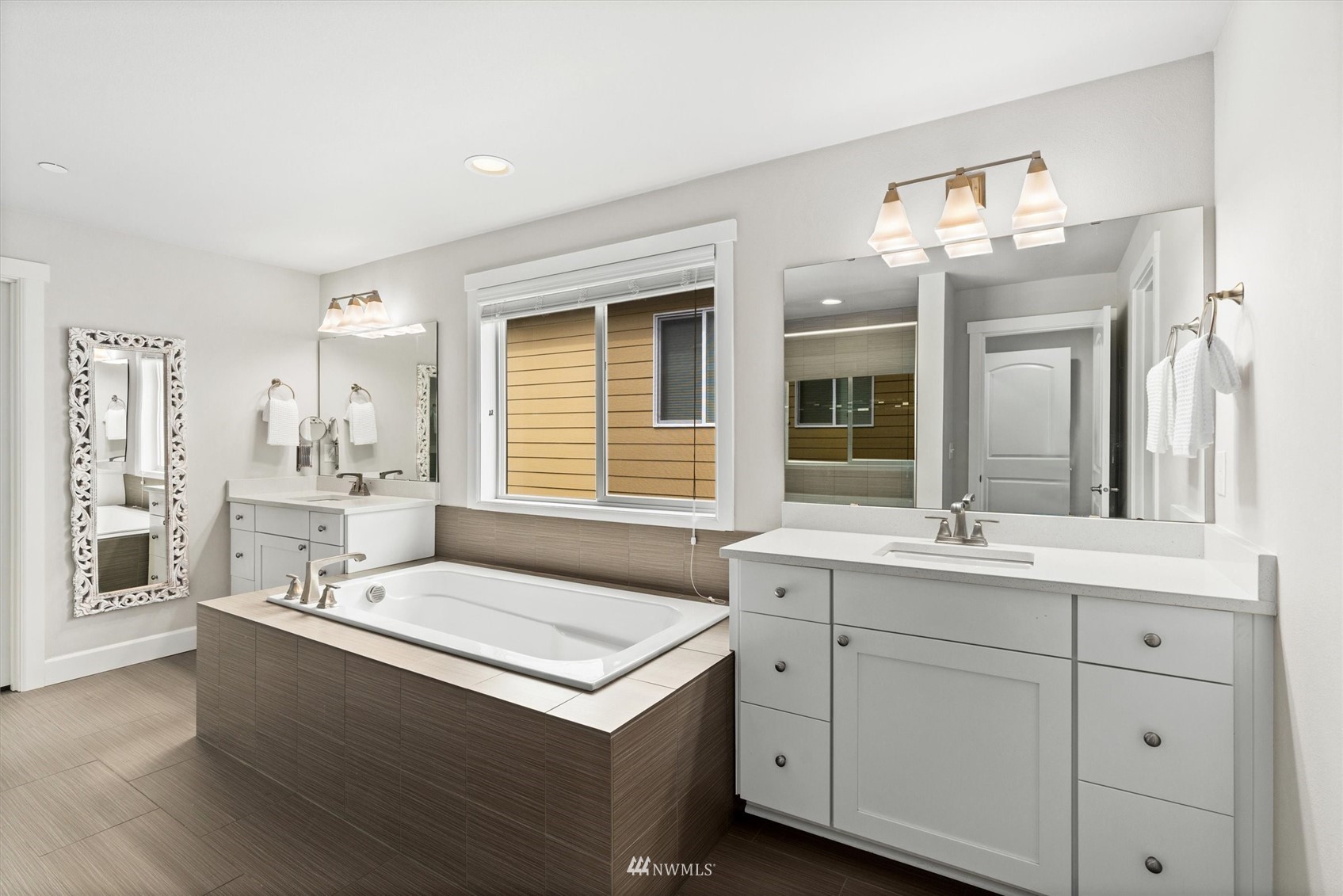 18307 3rd Drive Southeast Bothell, WA 98012 - Photo 21 of 40 a bathroom with a sink double vanity and a mirror
