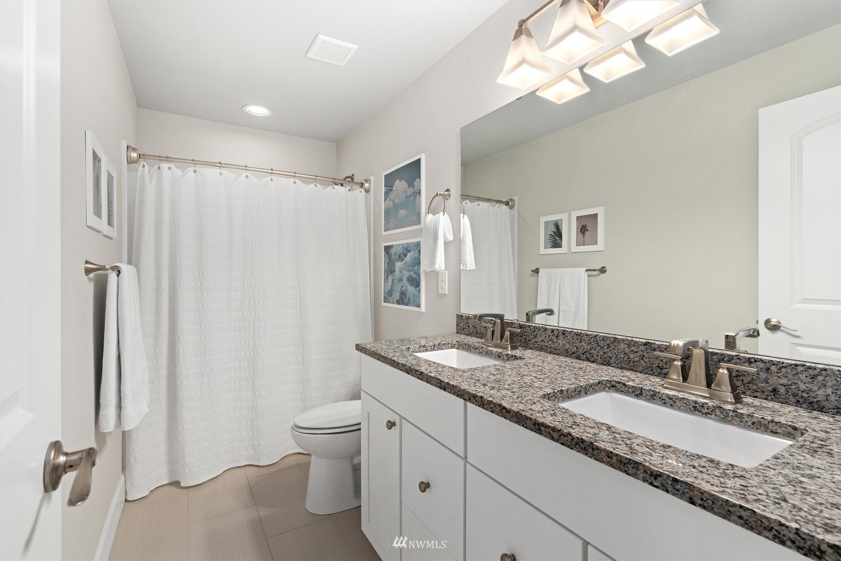 18307 3rd Drive Southeast Bothell, WA 98012 - Photo 25 of 40 a bathroom with a granite countertop double vanity sink toilet and shower