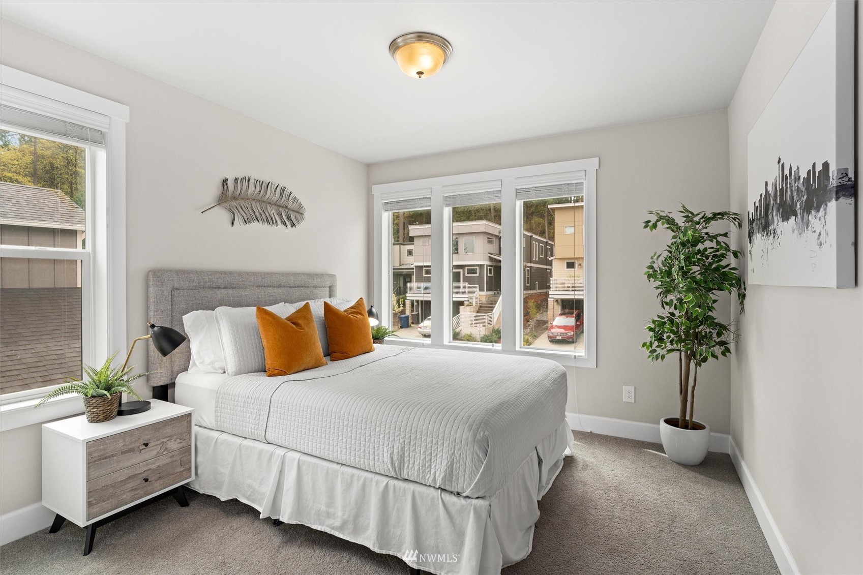 18307 3rd Drive Southeast Bothell, WA 98012 - Photo 27 of 40 a bedroom with a large bed and a potted plant