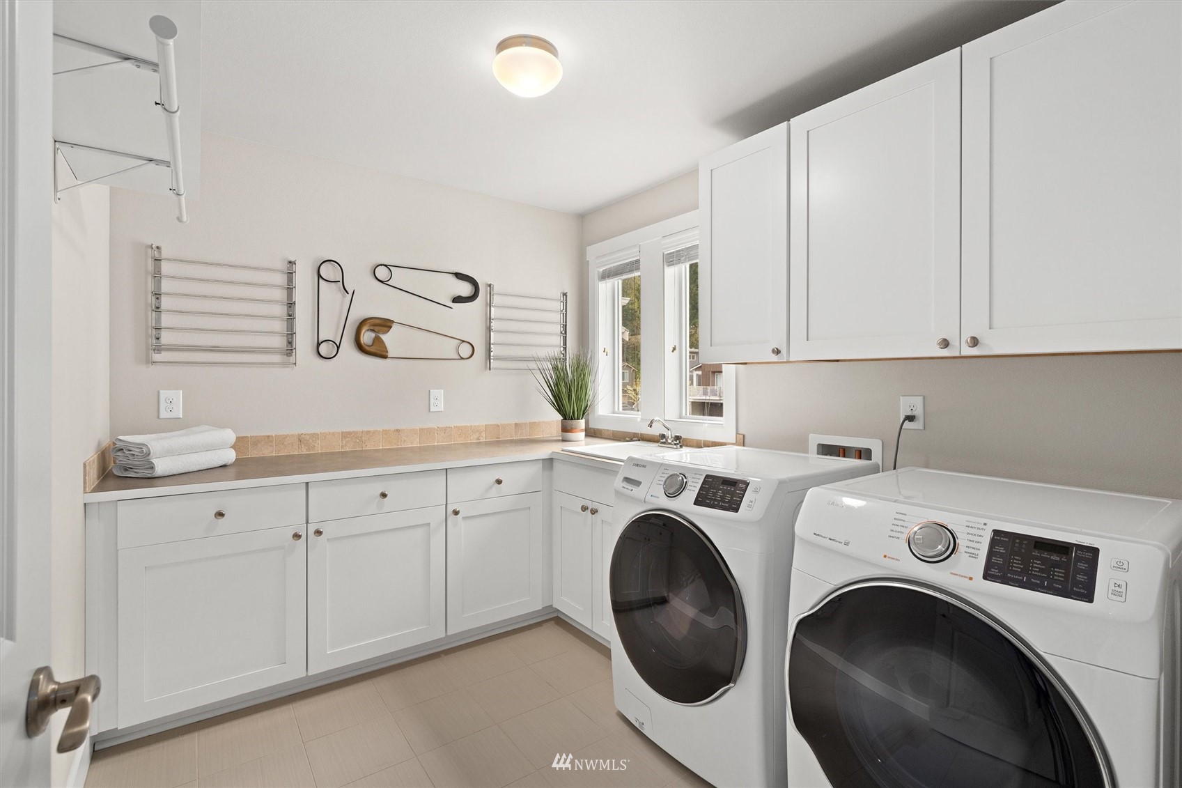 18307 3rd Drive Southeast Bothell, WA 98012 - Photo 28 of 40 a utility room with sink dryer and washer