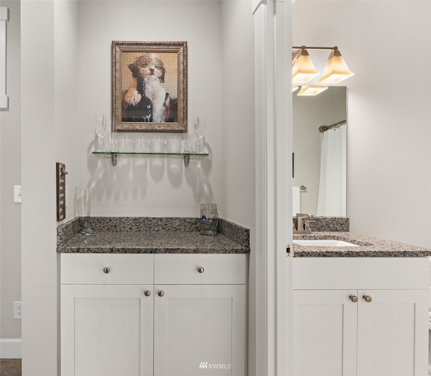18307 3rd Drive Southeast Bothell, WA 98012 - Photo 30 of 40 a bathroom with a granite countertop sink and a mirror