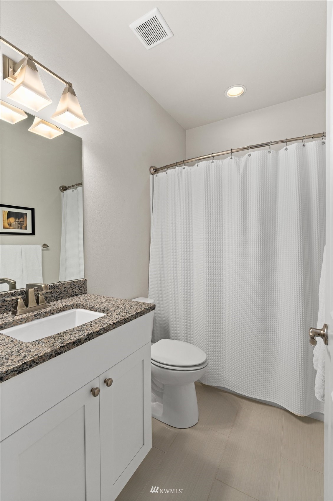18307 3rd Drive Southeast Bothell, WA 98012 - Photo 31 of 40 a bathroom with a granite countertop sink and a mirror