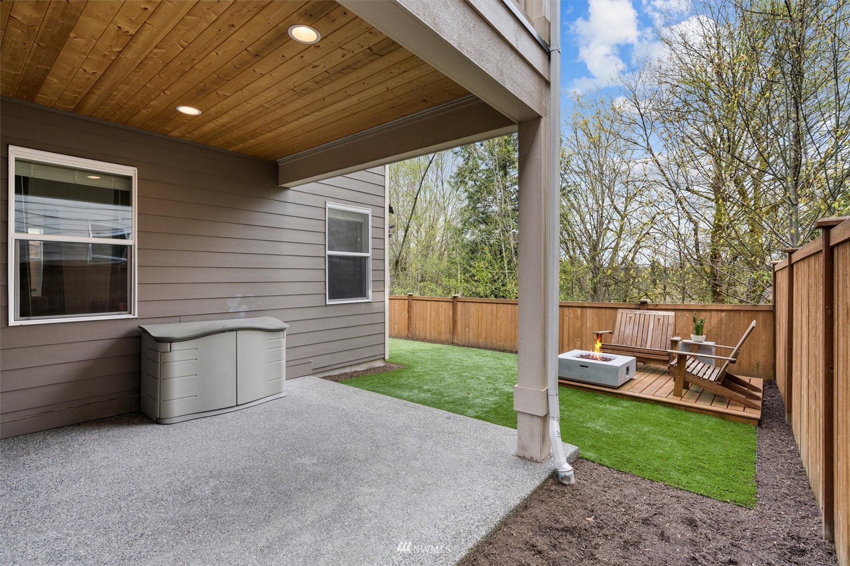 18307 3rd Drive Southeast Bothell, WA 98012 - Photo 36 of 40 a view of a patio with couches chairs potted plants and floor to ceiling window