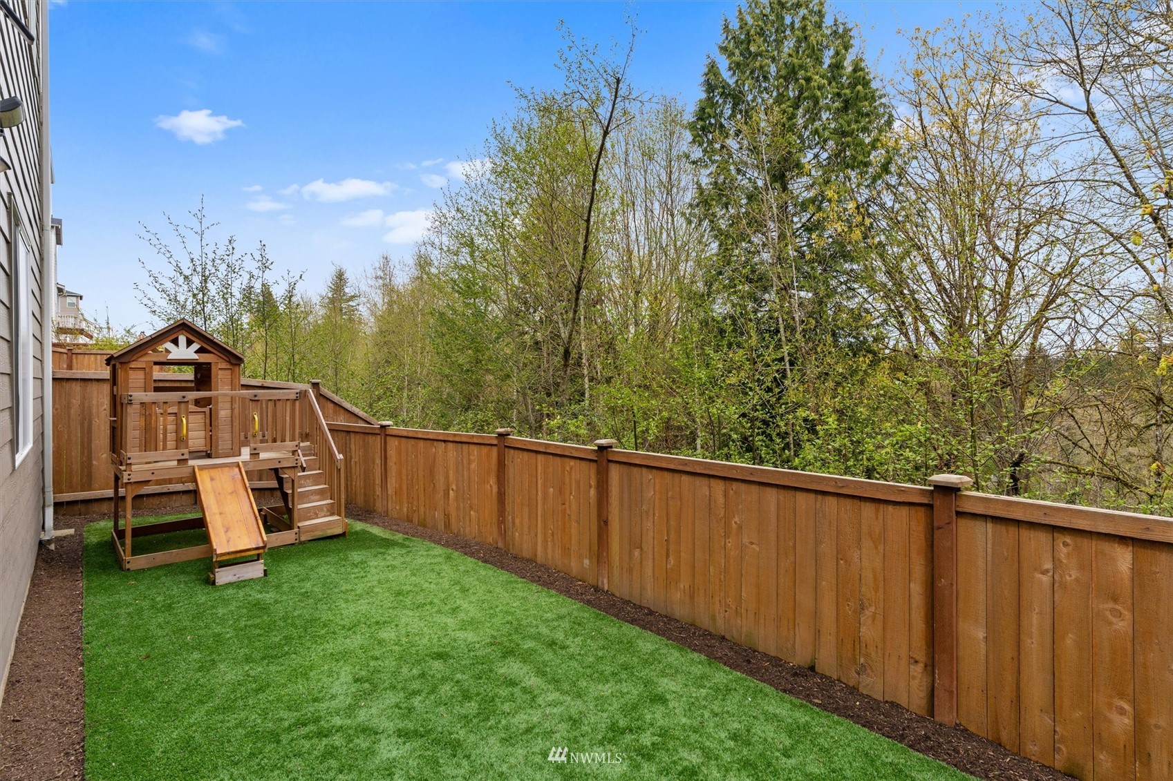 18307 3rd Drive Southeast Bothell, WA 98012 - Photo 39 of 40 a view of a backyard with wooden fence and large trees