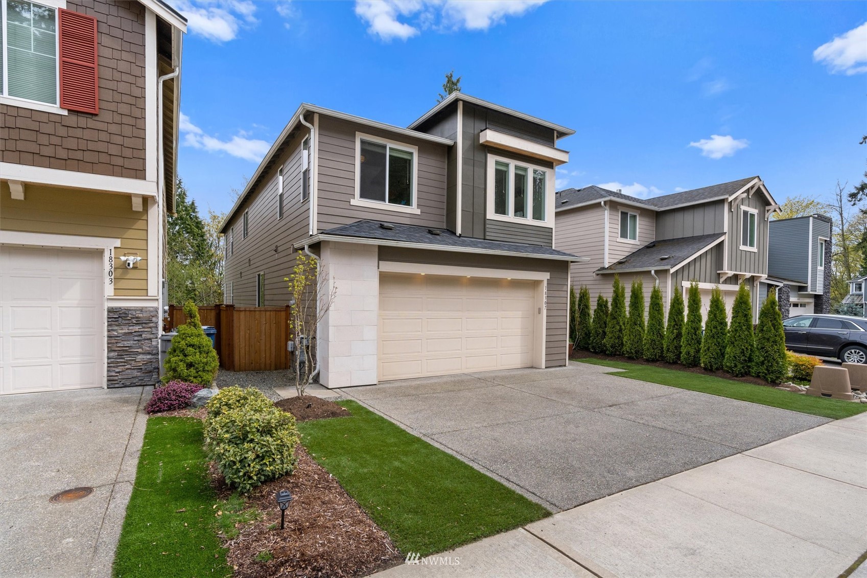 18307 3rd Drive Southeast Bothell, WA 98012 - Photo 40 of 40 a front view of a house with a yard and garage