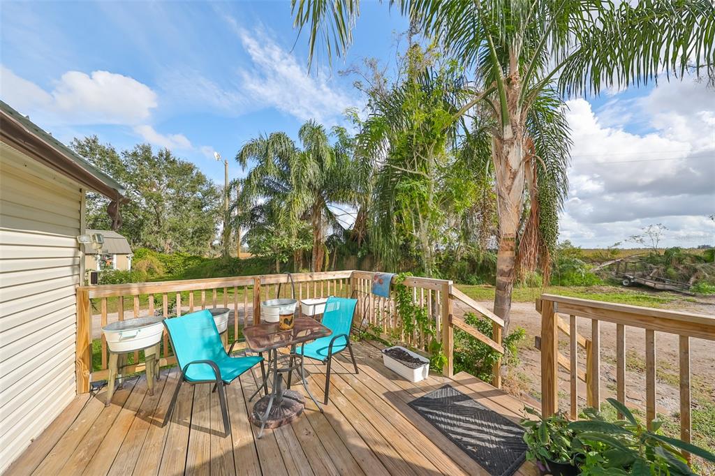15624 Carlton Lake Road Wimauma, FL 33598 - Photo 26 of 35 a view of balcony with furniture and wooden deck