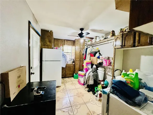 a view of gym equipment with a potted plant