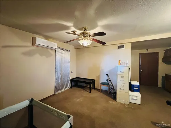 a room with furniture and white walls